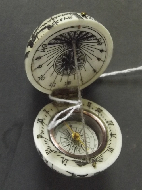 A bone compass and sundial in the form of a globe, 1½'' diameter