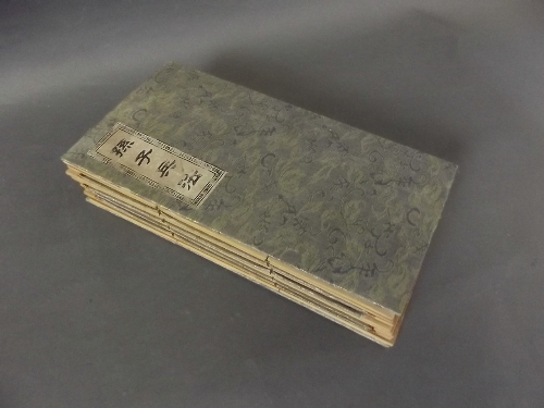 A Chinese consentina bamboo book with a green cloth binding, 5'' x 9¼''