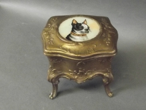 A bronzed metal casket with a painted plaque of a French bulldog to lid, 4'' high