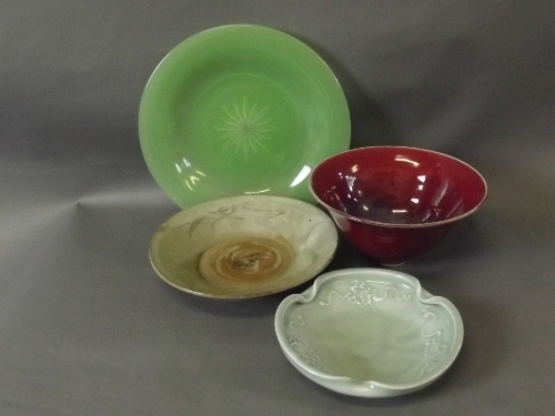 A flambé glaze steep sided bowl, a Peking glass plate, and 2 other green glazed dishes, 10½''