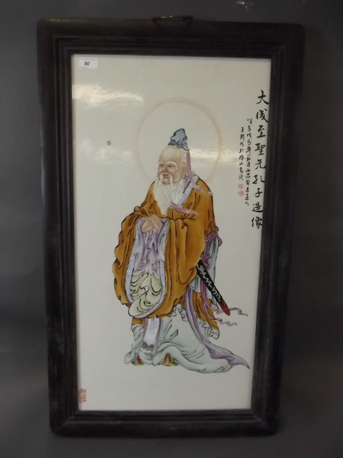 A Chinese ceramic screen depicting a travelling dignitary, 21'' x 35½''