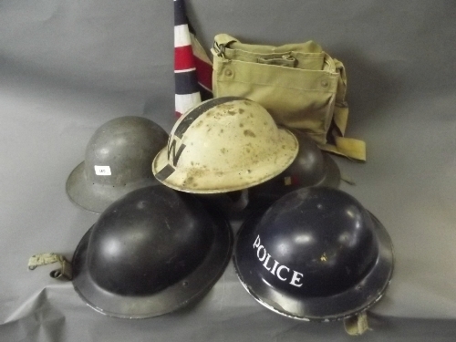 A quantity of WWI tin hats, etc