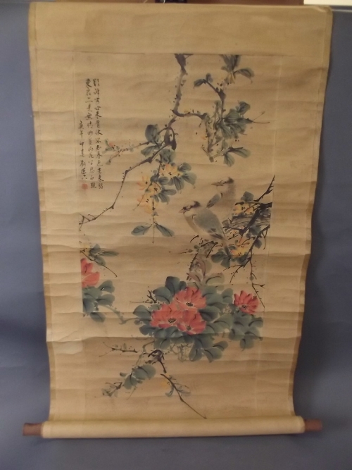 A large Chinese scroll decorated with birds and blossoming trees, 18'' x 36''