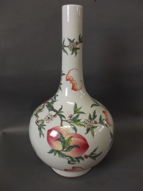 A large Chinese bottle vase decorated with peaches and bats, 6 character mark to base, 15'' high