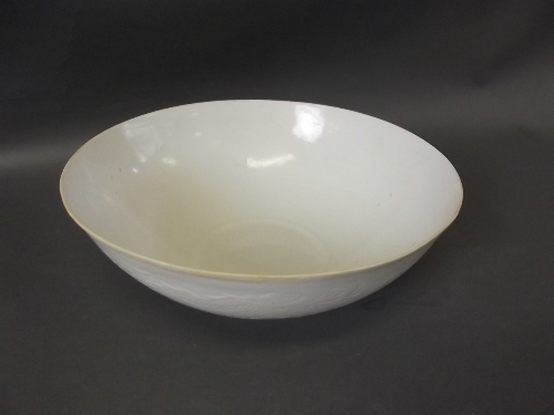 A C19th white eggshell bowl with raised dragon decoration, 4 character mark to base, 8'' diameter