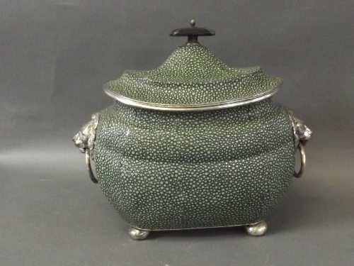 A faux shagreen and silver plated tea caddy with ringed lion head handles to side and bun feet, 6½''