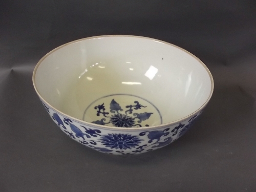 A C19th Chinese porcelain bowl decorated with dragons and floral pattern, 6 character mark to