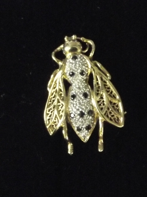 A 9ct gold sapphire and diamond brooch in the form of a bee