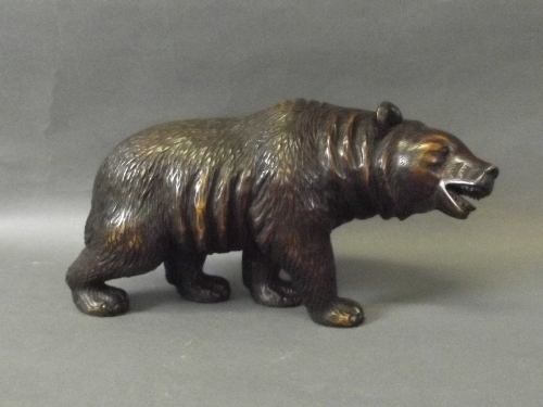 A Black Forest style carved wooden bear, 9'' long