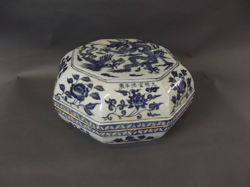 A Chinese blue and white shallow octagonal bowl and cover decorated with dragon and phoenix, with