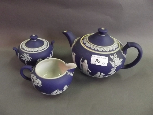 A C19th Wedgwood Jasperware three piece tea service decorated with classical figures, chip to