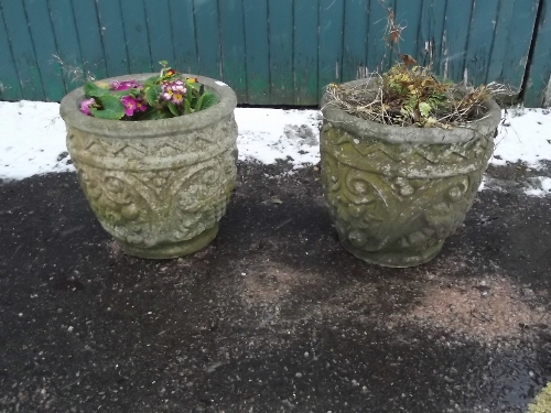 A pair of stone garden urns (matched), 15'' high
