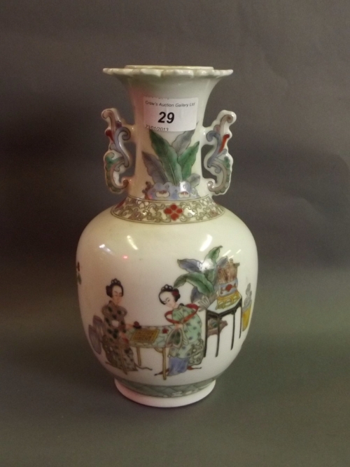 A Chinese porcelain handled vase with famille-verte enamel decoration of young women playing a board