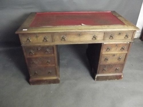 A Victorian oak 9 drawer pedestal desk, 48'' x 27'' x 29''