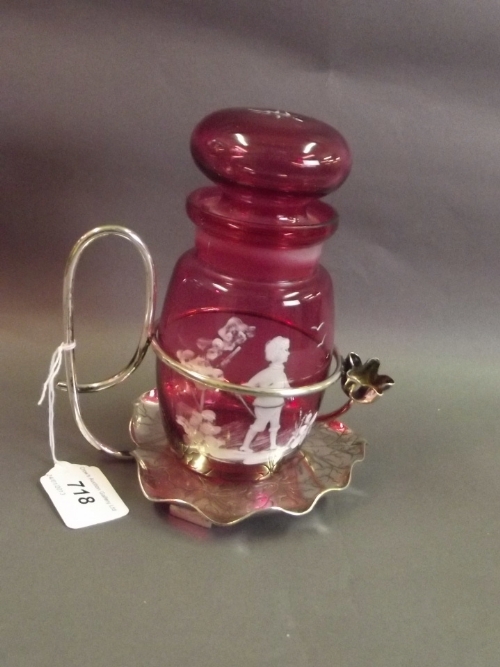 A ruby glass pickle jar and cover with Mary Gregory style hand painted decoration, in a silver