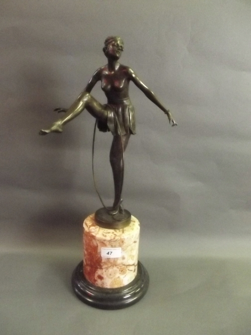 A large Art Deco style bronze figure of a dancing girl with hoop, 20'' high