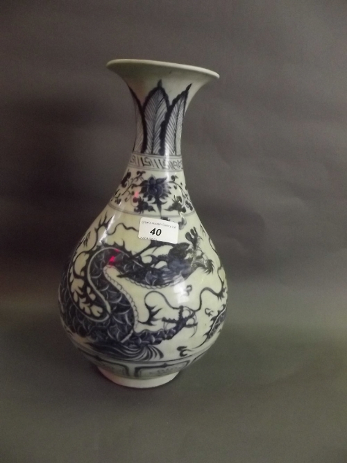 A Chinese baluster, shaped vase with blue and white dragon decoration, 13'' high