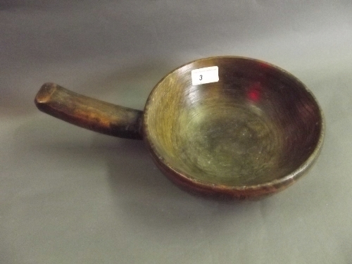 An antique treen turned drinking bowl, 13'' wide