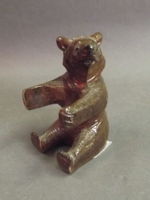 A carved wooden Black Forest bear inkwell (inkwell missing), 3'' high