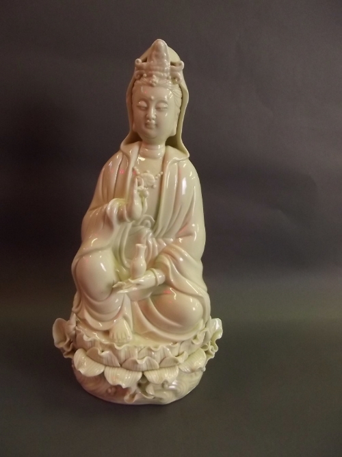 A Blanc de Chine figure of Guan Yin, 10½'' high