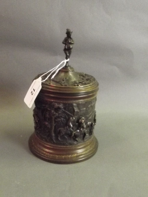 A C19th French patinated bronze repousse pot and cover decorated with figures and horses marked 'A.