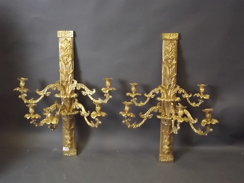 A pair of gilt metal 5 branch wall sconces with scrolled arms and paterae decoration, 32'' long