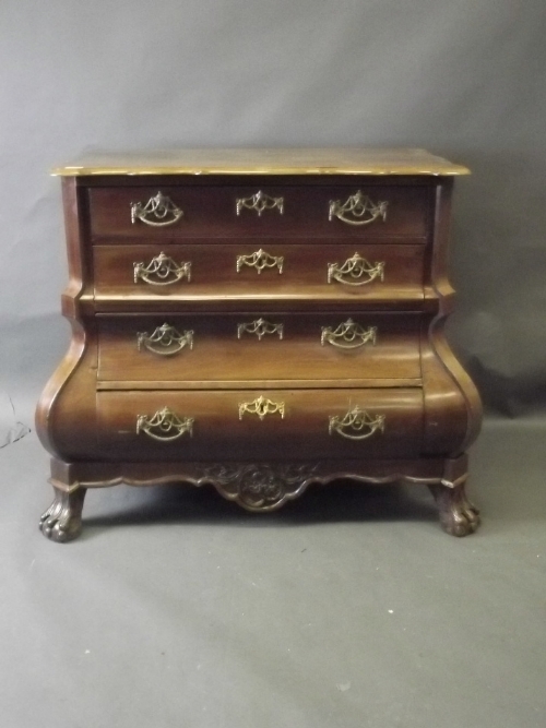 A C19th continental walnut bombe shaped commode of 4 long drawers, with shaped top and canted