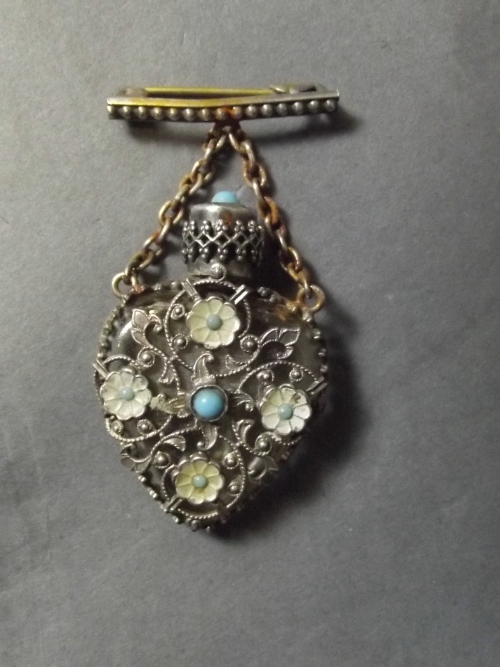 A small filigree mounted heart shaped scent bottle, with enamel and turquoise decoration, 1½'' long