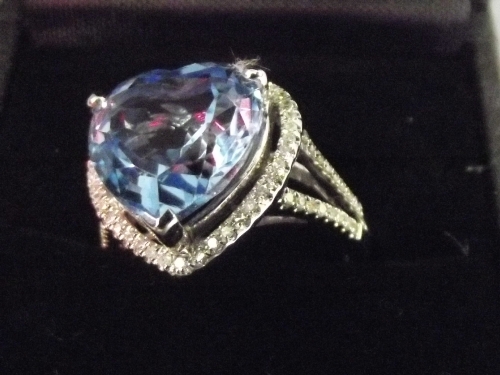A 14k white gold and diamond ring set with a heart shape blue topaz, approx 6.75ct, diamonds