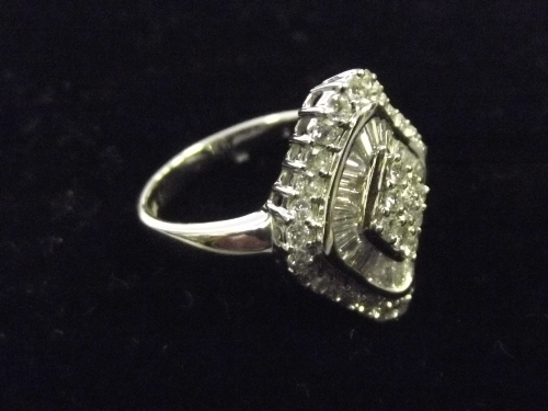 A good 18ct white gold lady's dress ring with central diamond, and baguette cut diamonds in a
