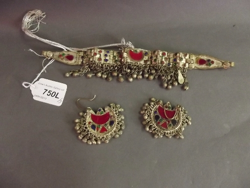A Yemeni low grade silver headdress set with semi-precious stones, and the matching pair of