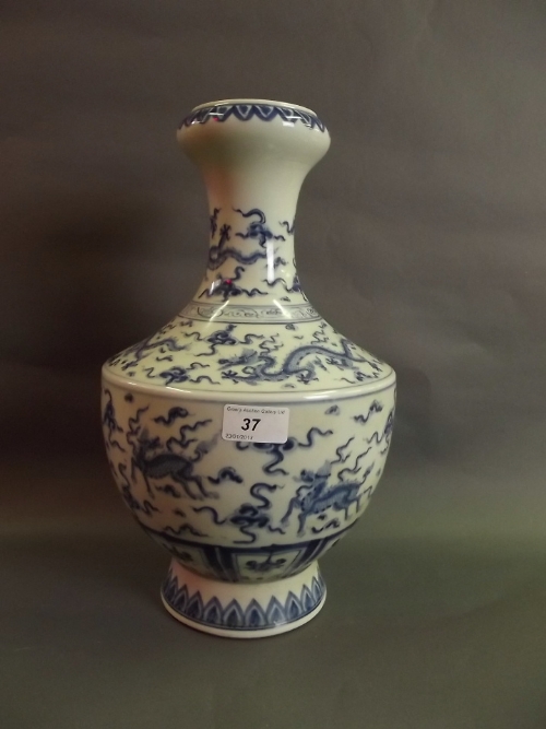 A Chinese porcelain vase with blue and white decoration of dragons, 6 character mark to base,