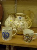Two Tuscan Decoro flower jugs 1940; together with a Decoro jug and two Wedgwood Coronation mugs,