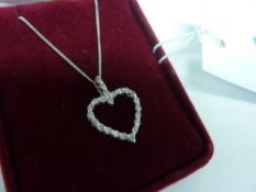 Platinum and diamond heart shaped pendant on chain stamped 750