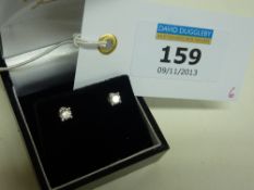 Pair of diamond stud ear-rings stamped