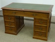 Edwardian walnut and pitch pine twin pedestal desk, inset leather writing surface, W125cm