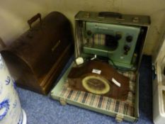 Singer sewing machine in walnut case, vintage Viking electric sewing machine and a Hermle chiming