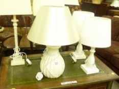 Two pairs of table lamps and another ceramic lamp.