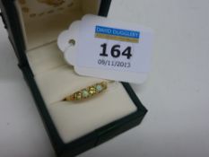 Peridot and opal ring