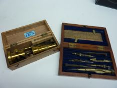 Early 20th century small brass microscope and a set of drawing instruments  cased