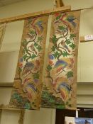 Two Oriental wall hangings of birds and an embroidery of a woman on a swing