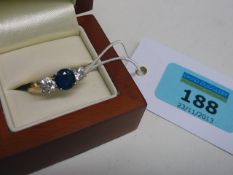 Diamond and sapphire three stone ring stamped 18ct size O-P