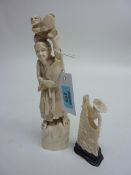 Japanese carved ivory okimono of a man holding feather with attendant, 27cm high and model of a