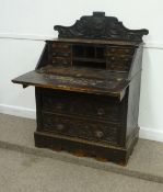 Victorian heavily carved oak three drawer bureau, W92cm
