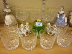 Six cut crystal champagne glasses, six cut crystal tumblers with a large glass paperweight and