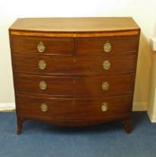 Early 19th Century mahogany bow front chest of two short and three long oak-lined drawers the top