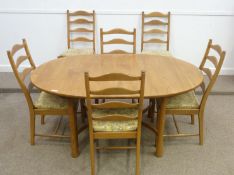 Ercol light elm extending dining table with butterfly leaf and six chairs, W108cm x L163cm closed
