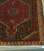 Persian Hamadan on red ground, 320cm x 105cm