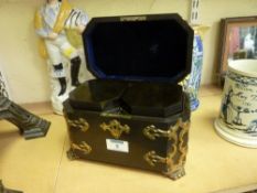 Victorian ebony veneered tea caddy with canted corners and engraved gilded brass mounts opening to