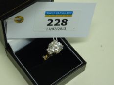 Cubic zirconia dress ring - large centre stone and three small stones to each shoulder hallmarked